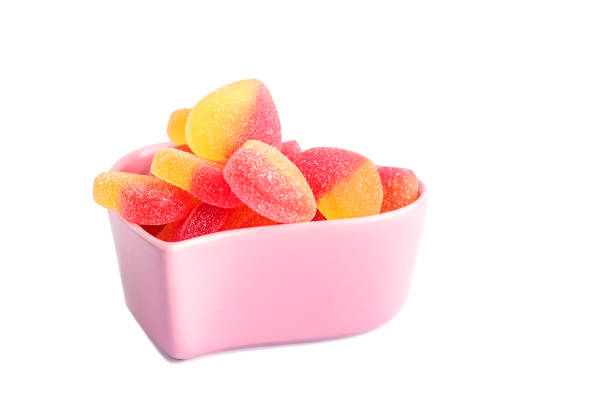 istock Jelly fruit marmalade in a decorative vase, isolated on a white background. 1453315215