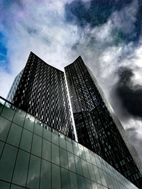 istock Cloudy sky and high rise buildings 1453318121
