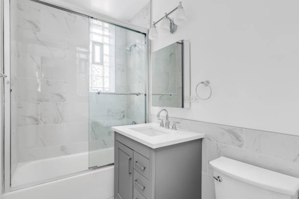 istock A bathroom with a grey cabinet and marble shower. 1453318125