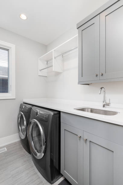 istock A laundry room with grey cabinets and appliances. 1453318127