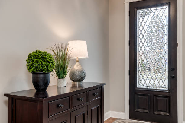 istock An entryway with a wood and glass front door. 1453318153
