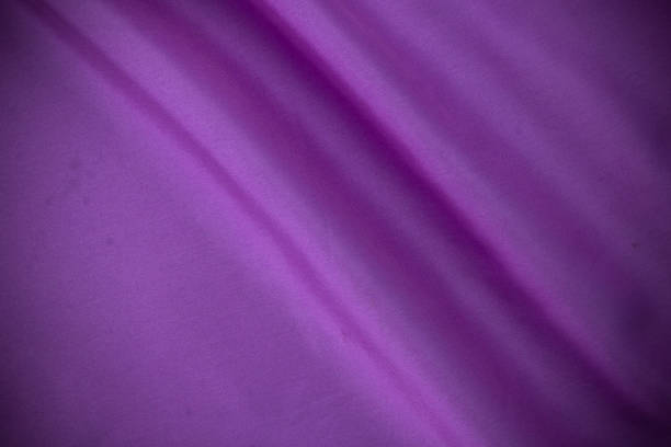 istock smooth white cotton Texture, curved silk background, pattern. Texture of white silk fabric. Beautiful emerald soft silk 1453319367