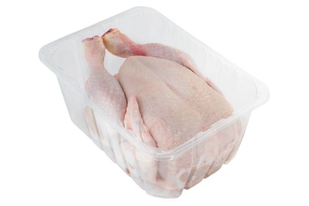istock Whole clean chicken in plastic container isolated on white white background 1453321510