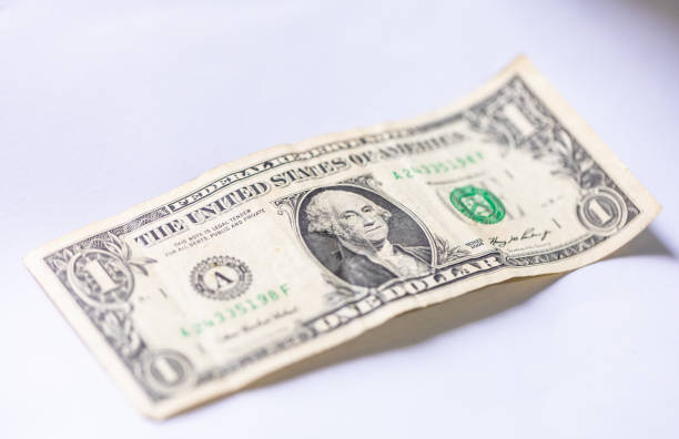 istock A one dollar bill on a white surface. American economy. 1453324888