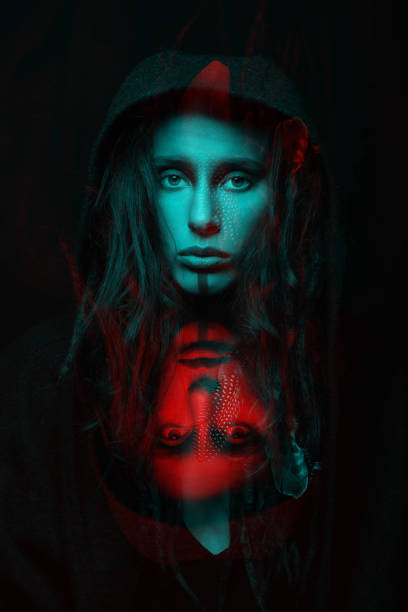 istock Model with dreadlocks hiding under hood studio portrait in RGB color split effect style 1453325135