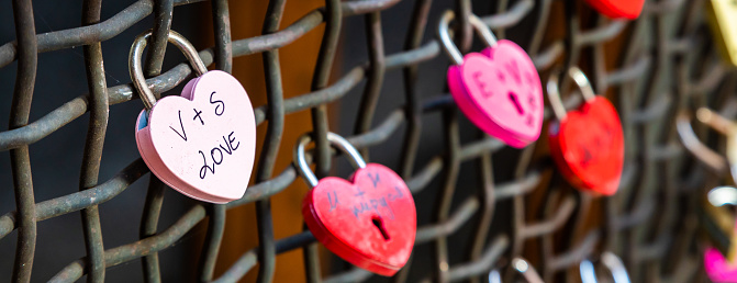 Verona, Italy - June 2022: love locks, concept for engagement, happiness, marriage and romantic relationship