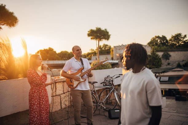 istock Man watching street musicians 1453325420