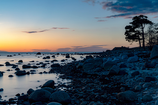 A sunset view of the rocky coastline at Hittarp