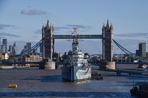 London, UK - October 6 2021: Tower Bridge and HMS Belfast museum ship, daytime view
