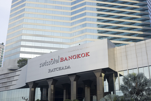 Swiss Hotel in Bangkok Huai Khwang seated at Ratchadaphisek Road near adult massage entertainment buildings.