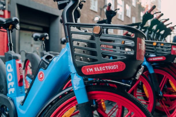 Close up of I'm Electric sign on Dott bike parked on a street in Soho, London, UK. stock photo
