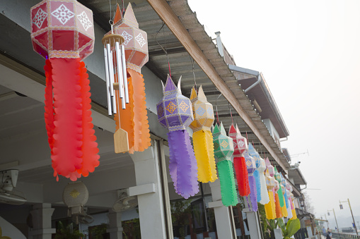 Multi colored thai lantern decor at wooden old houses in Chiang Khan in north Thailand