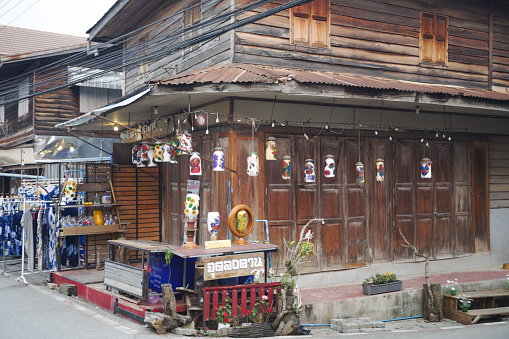 Old wooden house with craft lantern decor in Walking Street of  Chiang Khan in north Thailand in morning