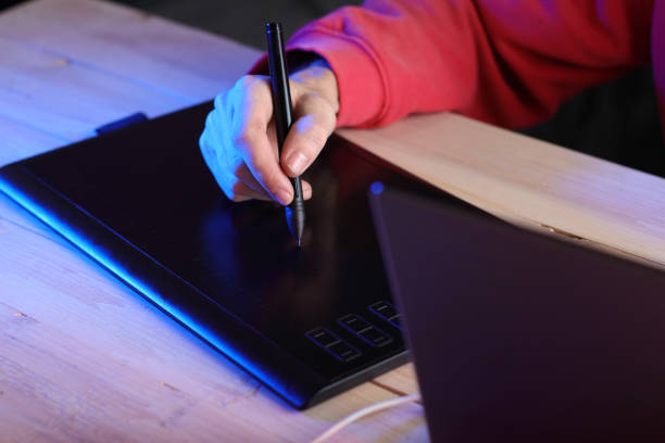 istock writing on a graphic tablet with a felt-tip pen by a person 1453331243