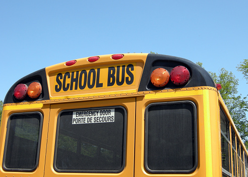 Closeup of the back of a typical school bus in North America.