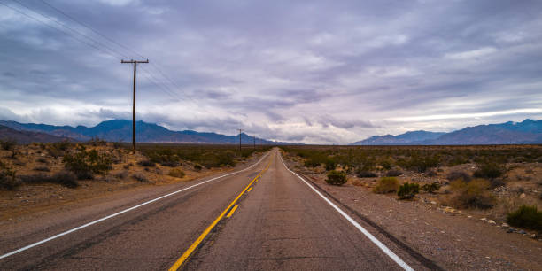 istock Dramatic cloudscape over Kelbaker Road near Granite Peak 1453334142