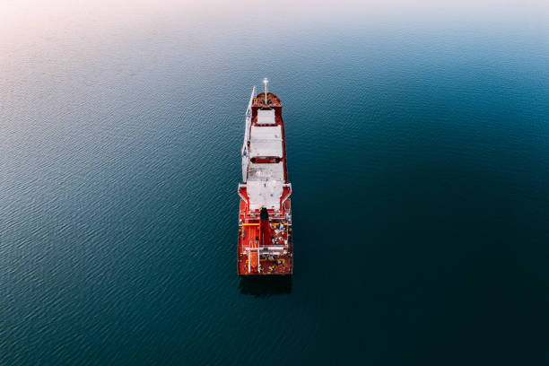 istock Aerial View Cargo Ship Waiting to Enter the Port 1453336250