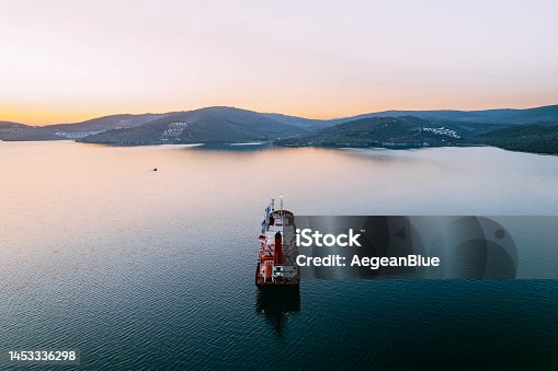 istock Aerial View Cargo Ship Waiting to Enter the Port 1453336298