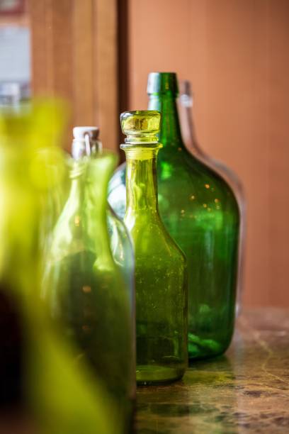 istock Vertical closeup of green and yellow bottles 1453337889