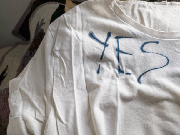 istock Writing Yes on T-Shirt with Ink 1453338897