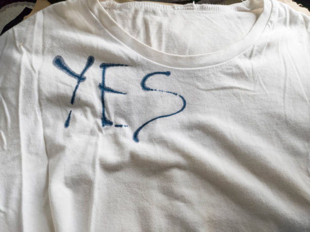istock Writing Yes on T-Shirt with Ink 1453338903