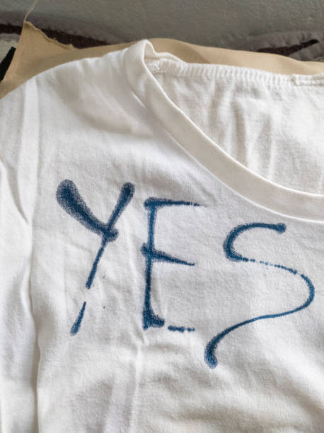 istock Writing Yes on T-Shirt with Ink 1453339454