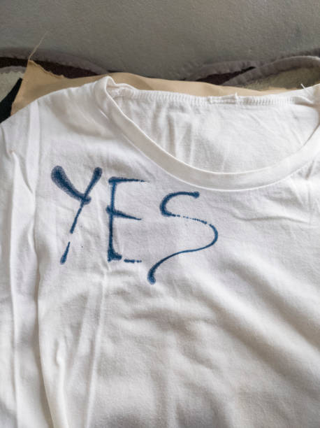 istock Writing Yes on T-Shirt with Ink 1453339458