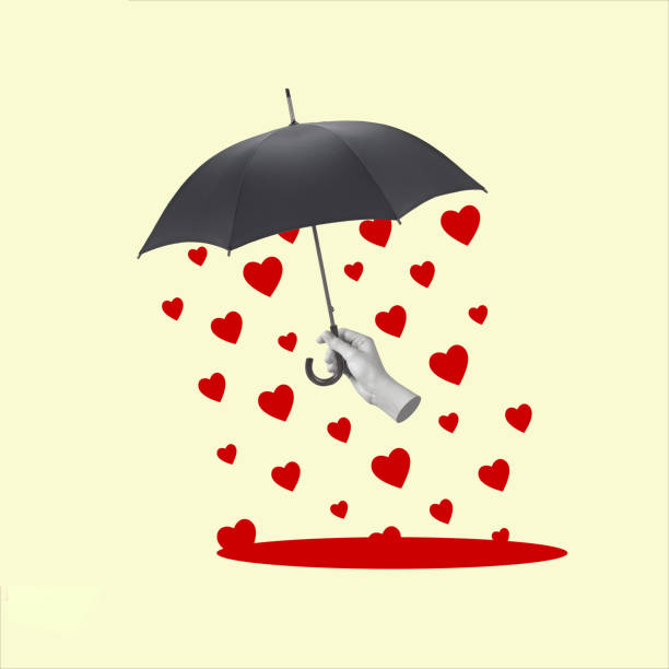 istock Hand holding an umbrella and rain from hearts. 1453340014