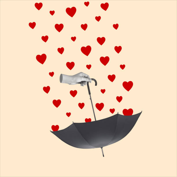 istock Hand holding an umbrella and rain from hearts. 1453340016