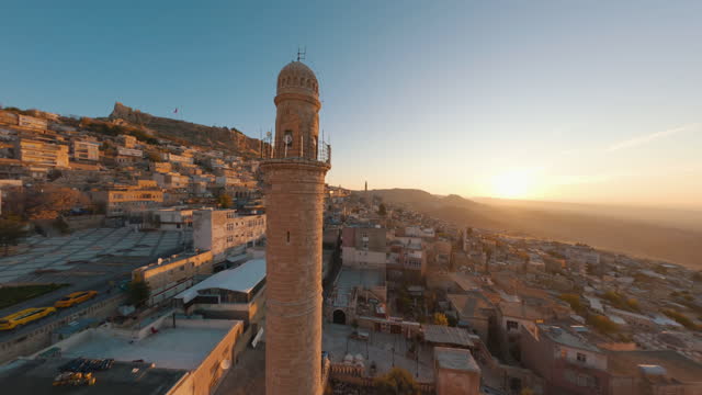 Mardin city general view with racing drone,Mardin Historical City FPV Drone,Aerial view of fpv drone Mardin old town cityscape, in the Middle East in Mesopotamia,City of Mardin, in the Middle East in Mesopotamia, Abdüllatif-Latifiye Mosque