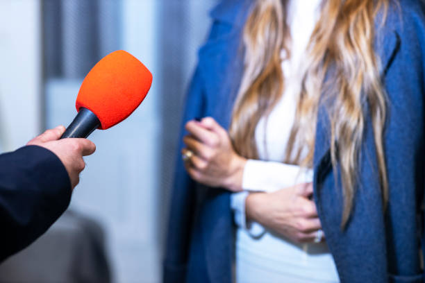 istock News journalist making media interview with unrecognizable female person 1453341053