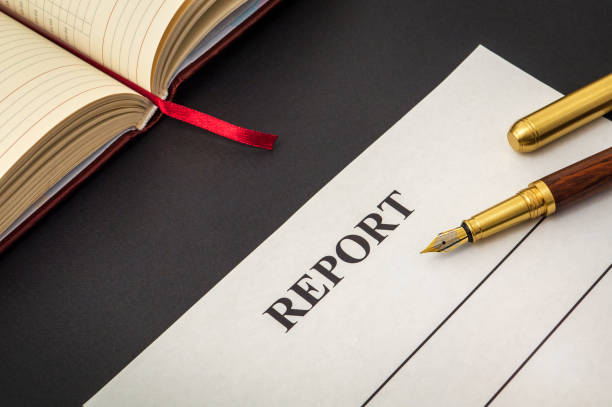 istock Blank form and pen for drawing up report on black table 1453341271