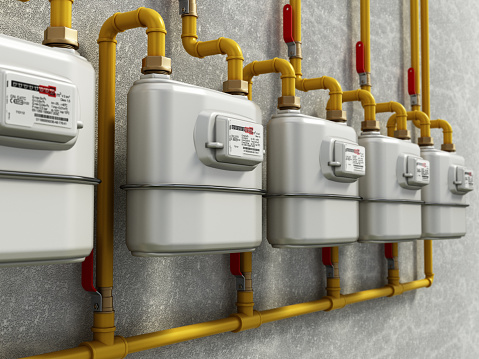 Generic domestic residential home LPG/natural gas meters in a row.