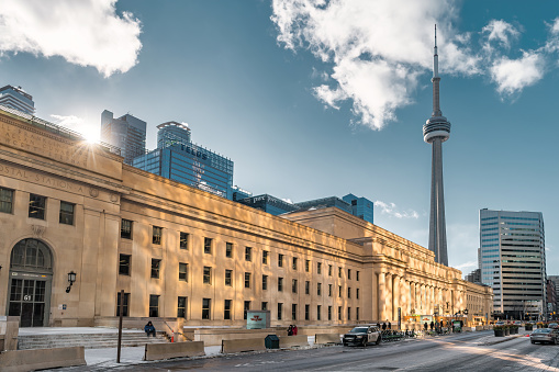 Panoramic view of Toronto skyline and CN Tower and ferry at sunset, Ontario, Canada