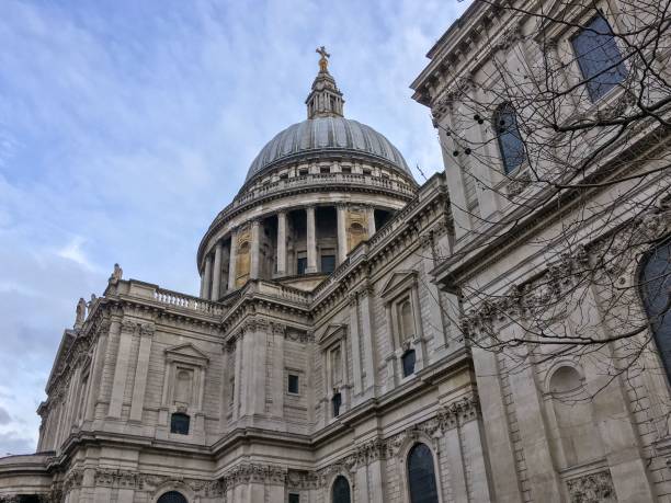 istock Beautiful side view of St. Paul's Cathedral against a blue sky 1453349880