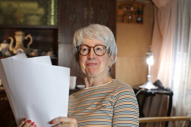 istock Senior woman getting good news 1453355452