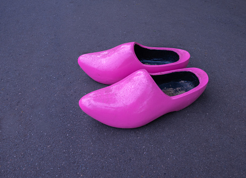 A pair of pink traditional Dutch wooden clogs in Netherlands