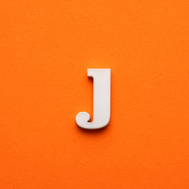 istock White lowercase letter j on orange foamy background 1453359182