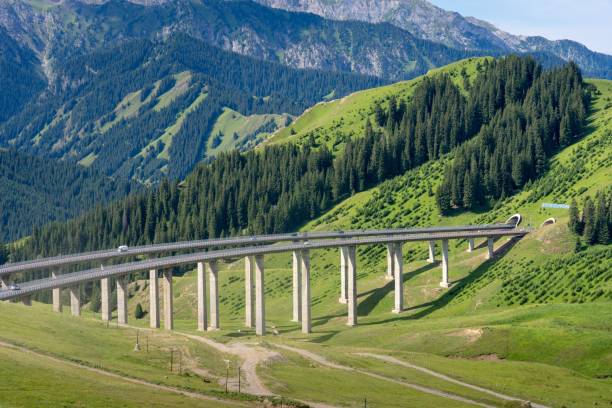 istock Bridge with two ways in a beautiful natural mountains area under blue sky 1453359261