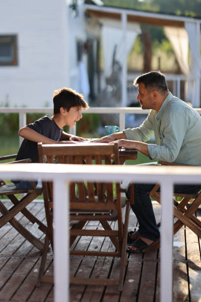 istock Angry strict father scolding lecturing naughty stubborn son 1453361160