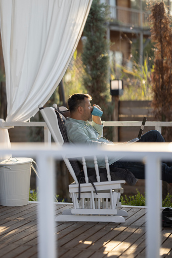 Businessman working on laptop at of his house