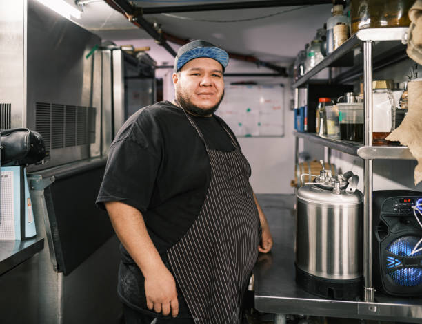 Master chef and cooks cooking in a natural food restaurant in Barcelona