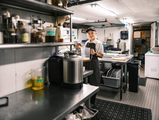 istock Young Korean female chef working in restaurant kitchen 1453363063