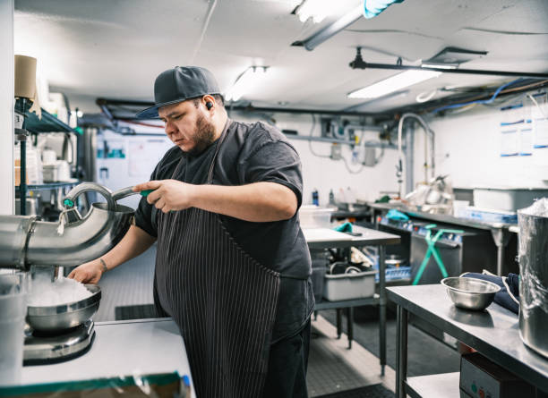 istock Young Mexican male chef working in restaurant kitchen 1453363404