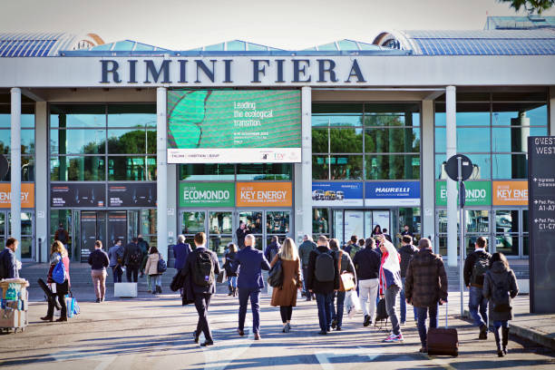 Rimini Fair People at the entrance to Rimini Fiera, during Ecomondo the trade fair for ecological transition and new models of circular economy. Rimini, Italy - November 2022 fiera stock pictures, royalty-free photos & images