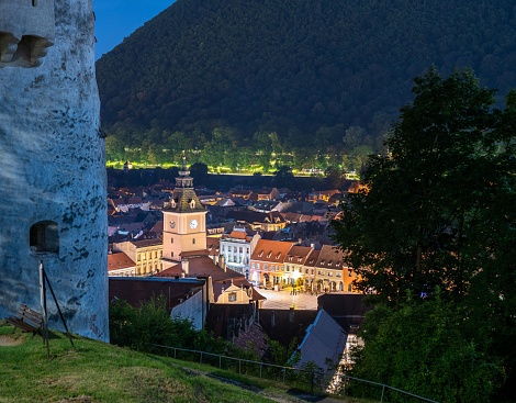 A night view of the old city of Brasov from the White Tower Monument in Transylvania, Romania