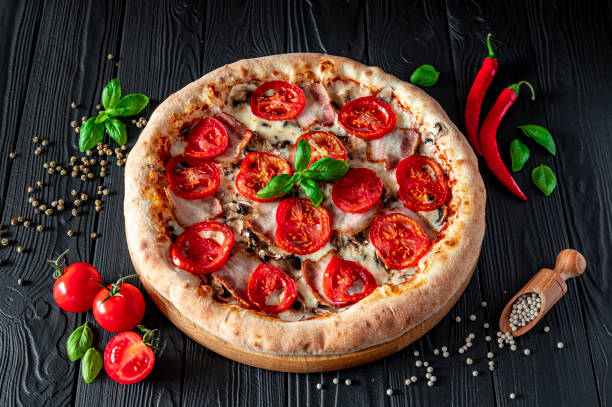 istock Tasty and big pizza with different types of meat 1453366787