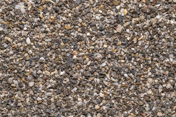 istock Road and plaster grit, loose chippings, crushed stone, surface, from above 1453368657