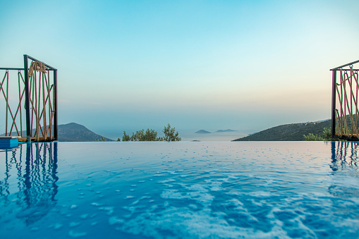 Unique beautiful view of the pool and sea at sunset taken in antalya,kas,kalkan