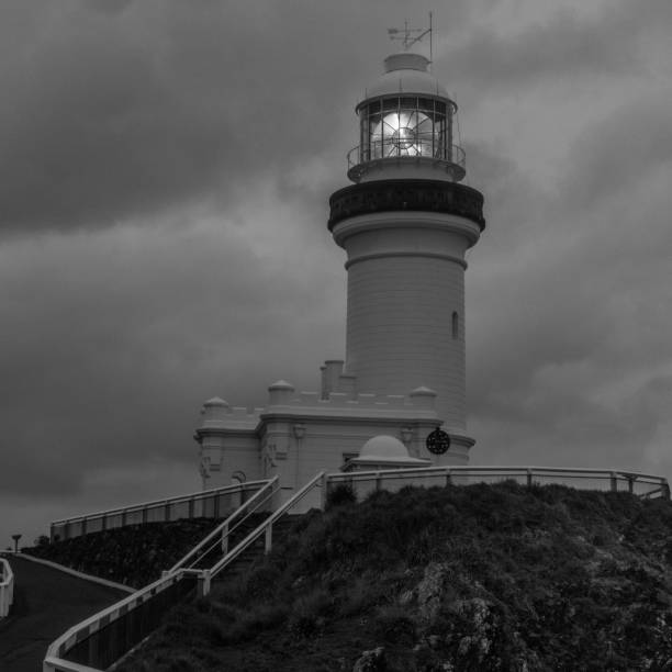 istock Byron bay lighthouse with heavy clouds, black and white 1453370100